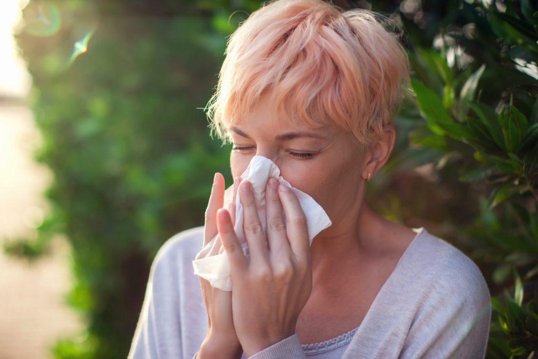 Young,Woman,With,Short,Hair,Sneezing,Into,Tissue.,Flu,,Allergy,